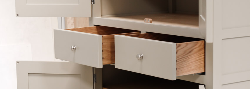 Larder cupboard handpainted in Farrow and Ball Estate Eggshell - Light Gray. Tulip wood carcass construction with birch ply panels and shelves. Oak dovetailed drawers and oak cornice.
