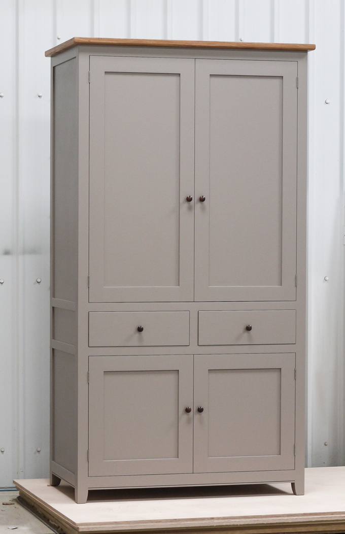 Shaker style freestanding larder cupboard handpainted in Farrow & Ball Estate Egshell - 'Charleston Gray'. Solid wood carcass with oak shelves, dovetailed drawers & spice racks. High quality solid brass hinges & shelf supports. Oak cornice & walnut knobs.