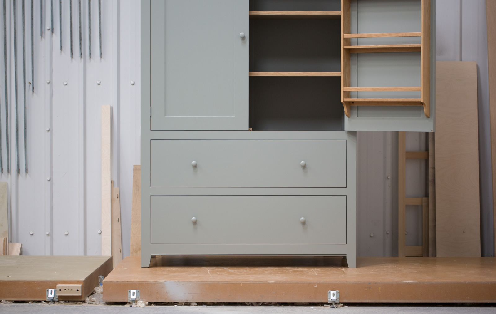Larder cupboard handpainted in Farrow & Ball, Estate Eggshell - 'Pigeon'. Tulip wood carcass with birch ply panels and oak faced birch ply shelves. Dovetailed oak drawers on high quality soft close runners. Oak spice racks. High quality solid brass butt hinges (satin chrome finish) with bespoke 'soft close' function. Adjustable brass shelf supports and 'hidden' adjustable levelling feet.